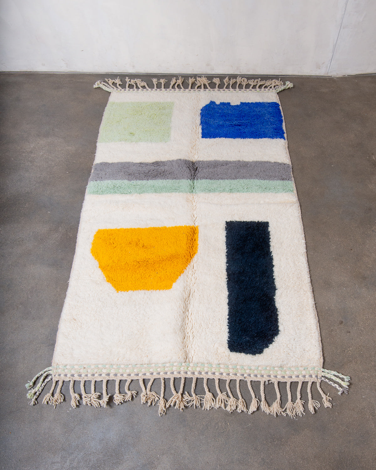 Modern, designer, handcrafted Berber rug from Morocco. Beniourain carpet with beautiful colours and patterns and fluffy wool texture.